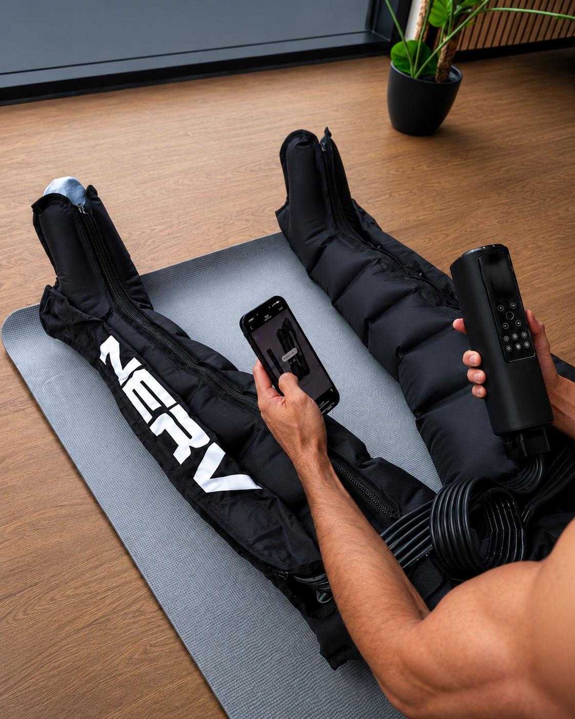 Athlete wearing NERV Squeeze compression boots after an intense workout.