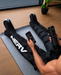 Athlete wearing NERV Squeeze compression boots after an intense workout.