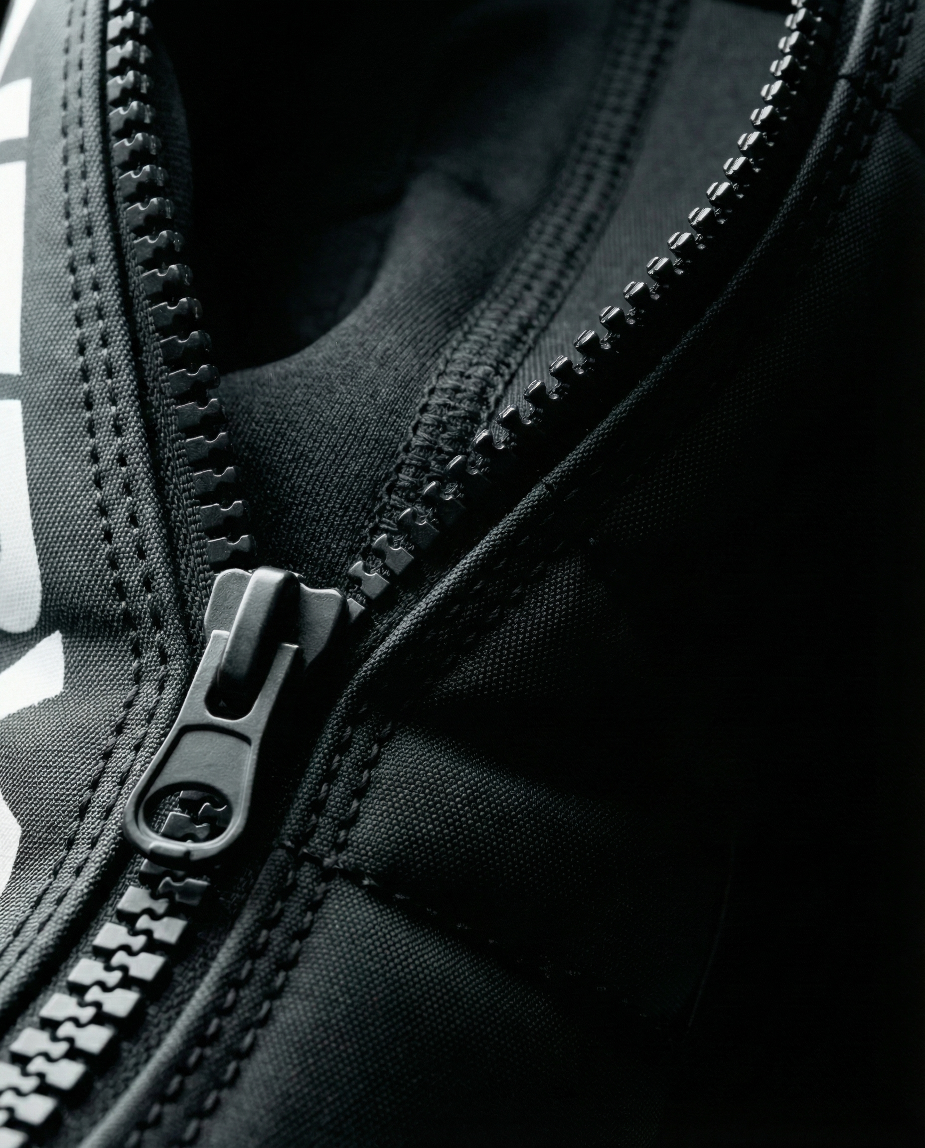 NERV Squeeze compression boots close-up showing the zip fastening and padded design