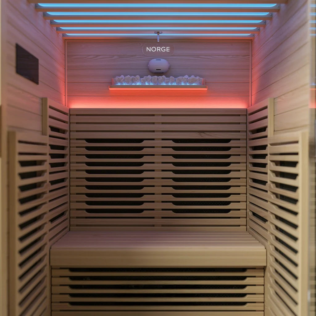 Interior view of a 2-person indoor infrared sauna with seating and back heater panel
