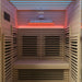Interior view of a 2-person indoor infrared sauna with seating and back heater panel