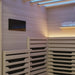 Close-up of a 2-person indoor infrared sauna interior and touchscreen control panel