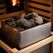 Close-up of traditional sauna heater with stones inside a 2-person outdoor hybrid sauna