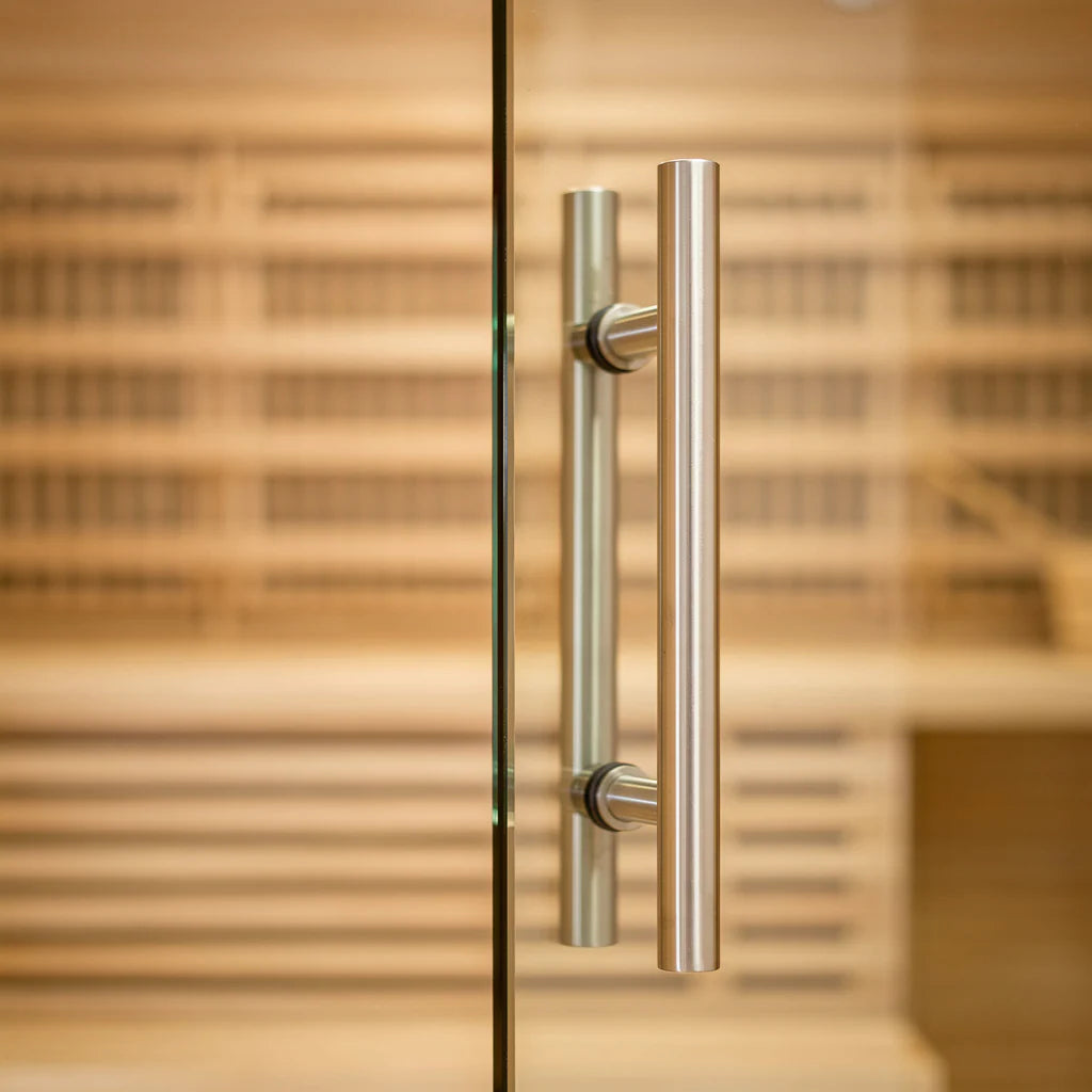 Close-up of tempered glass sauna door with handle on a 4-person indoor hybrid sauna