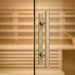 Close-up of tempered glass sauna door with handle on a 4-person indoor hybrid sauna
