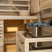 Close-up of traditional sauna heater with stones inside a 4-person indoor hybrid sauna