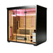 Angled view of a 4-person outdoor hybrid sauna with black coated exterior and glass door