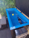 Plunge City Sub-Zero cold plunge ice bath filled with water in an outdoor setting
