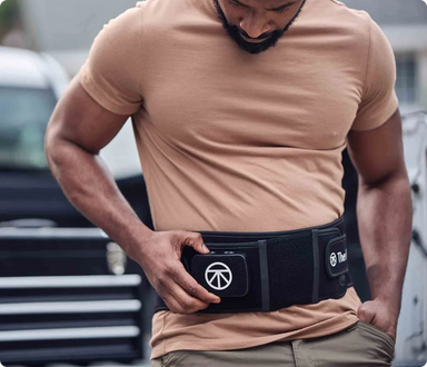 ThermBack LED wearable lower back therapy device in use